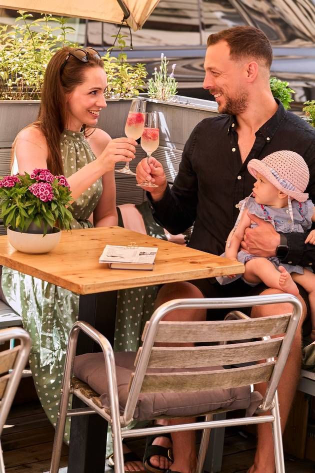 A family raising a toast, portrait view.